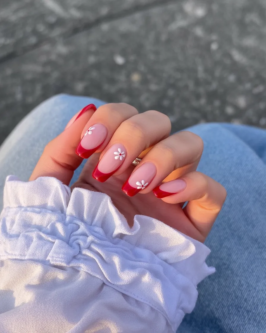 Red French tip nails with white flowers