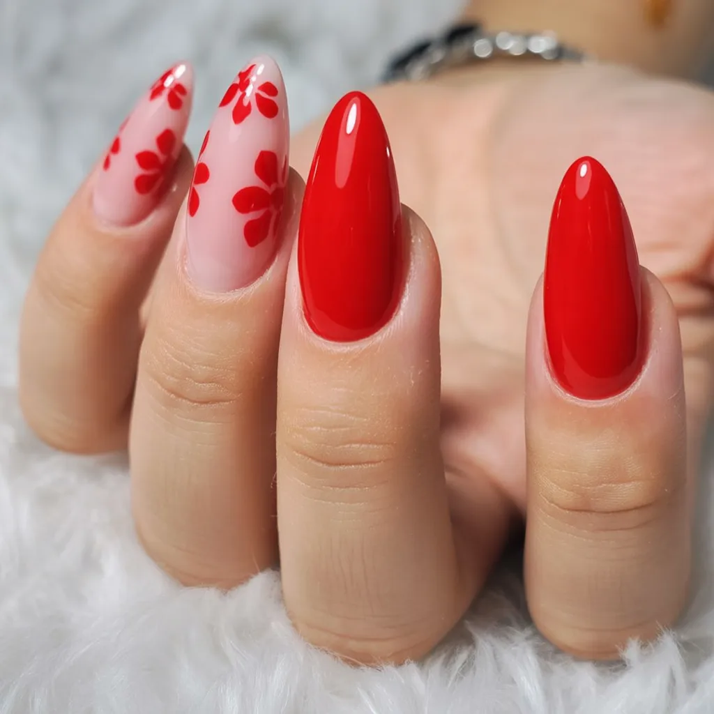 Bold red almond nails with floral accent tips