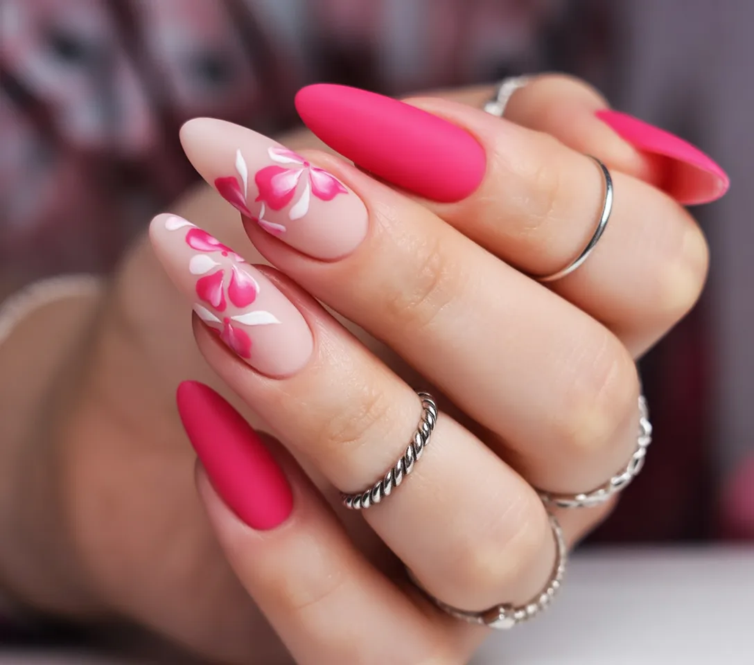 Matte pink and red almond nails with floral art