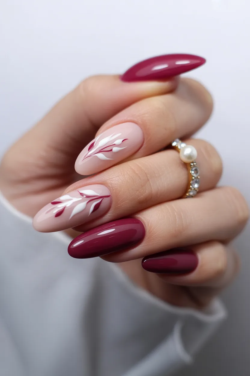 Burgundy and blush almond nails with line art